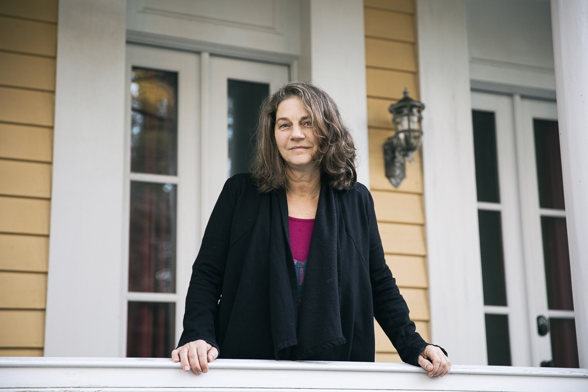 caucasian woman on front porch in charleston south carolina brandon clifton atlanta portrait and lifestyle photographer