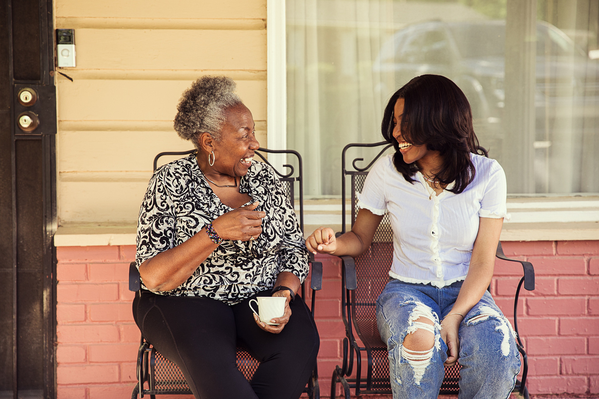 grandmother having coffee with granddaughter on front porch brandon clifton atlanta photographer