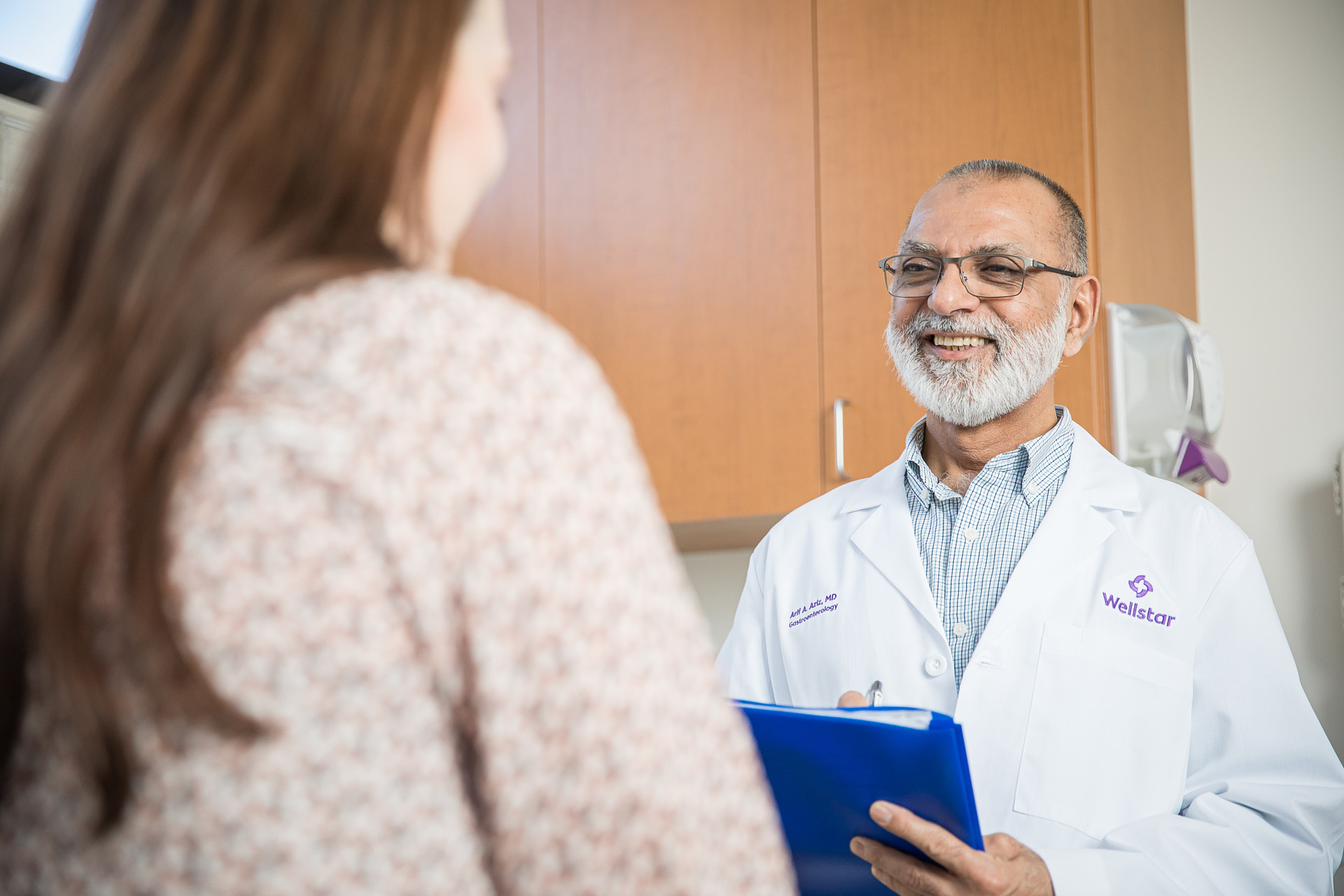 doctor consulting with female patient brandon clifton atlanta photographer