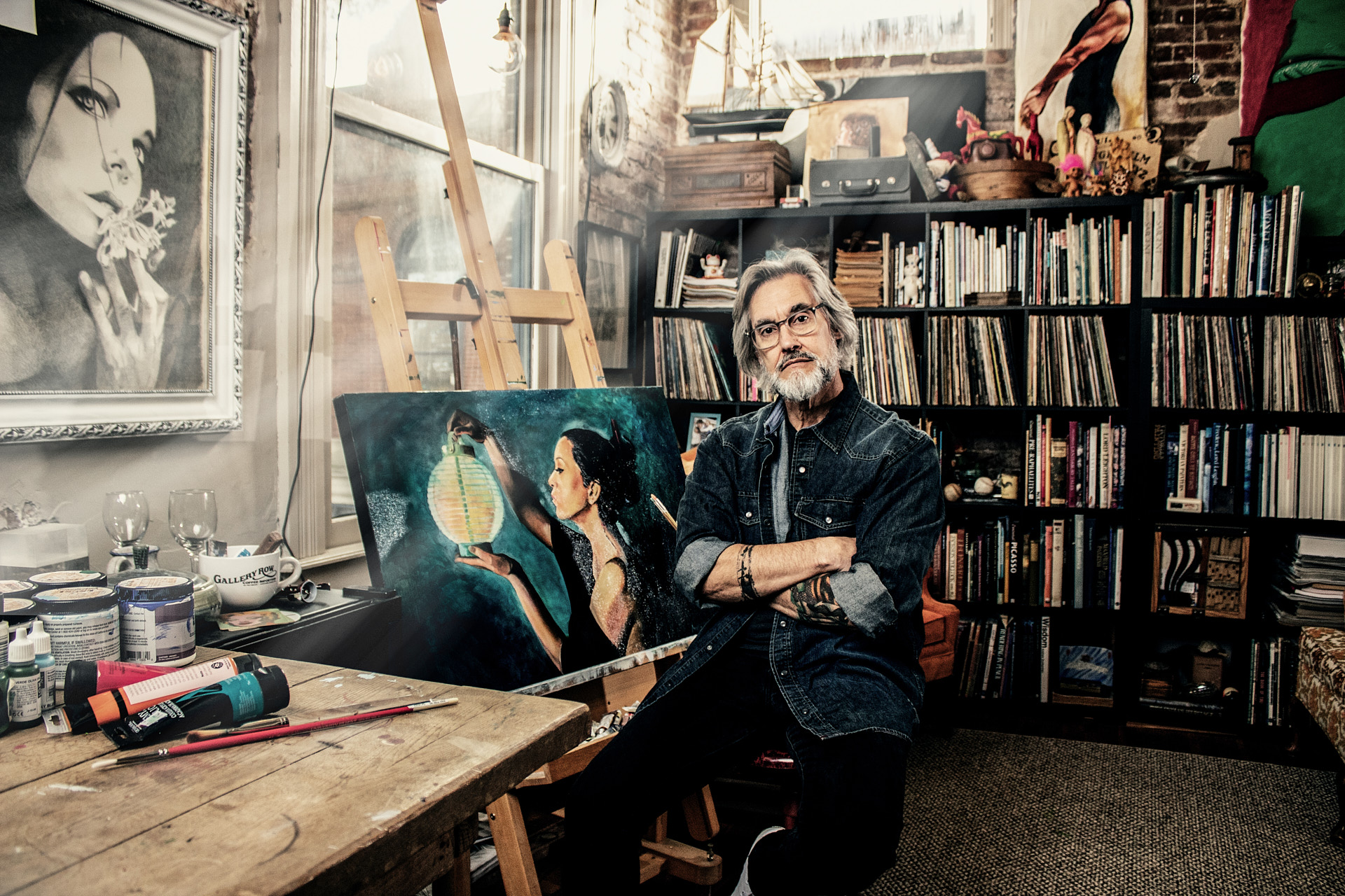 painter in art studio with art surrounding him brandon clifton atlanta photographer